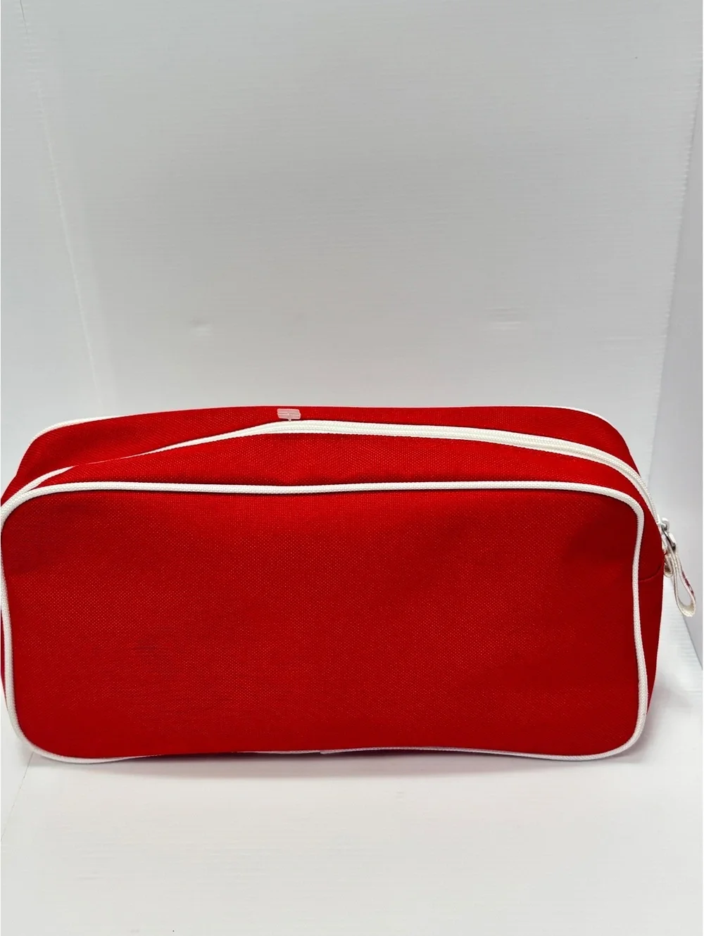 Clinique Red Canvas Cosmetic Bag with White Image Stitching and Zipper Closure